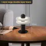 Elegant marble table lamp with soft glow on bedside table in bedroom