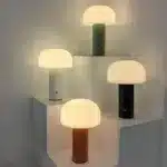 Modern mushroom table lamp with warm glow on wooden table