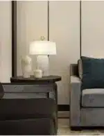 Elegant marble table lamp with soft glow on bedside table in bedroom