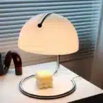 Modern table lamp with mushroom shade in a cozy bedroom