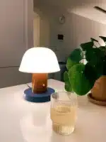 Nordic retro mushroom table lamp with warm LED glow on a bedside table