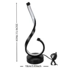 Modern desk lamp with adjustable arm and USB cable, glowing warmly on a wooden desk