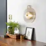 Modern wall lamp with minimalist Nordic design illuminating a cozy bedroom bedside