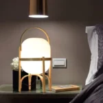 Modern table lamp with wood and glass base, minimalist design for bedroom or living room
