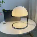 Modern table lamp with mushroom shade in a cozy bedroom