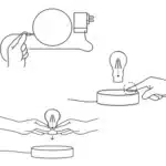 Floating LED lamp with levitating bulb on a wooden desk in a modern living room