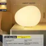 Modern table lamp with warm glow on bedside table