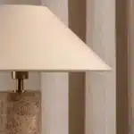 Modern marble LED table lamp with white fabric shade on wooden desk