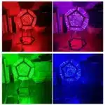Dodecahedron gaming light with vibrant RGBW colors illuminating a gaming desk setup