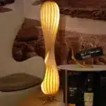 Wooden floor lamp with warm glow in a cozy living room