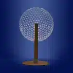 3D LED table lamp with wooden base and acrylic art glowing in a cozy room