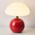 Mushroom table lamp with cream ceramic shade on bedside table