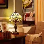 Vintage table lamp with handmade colored glass shade casting warm ambient light