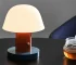 Nordic retro mushroom table lamp with warm LED glow on a bedside table