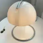 Modern table lamp with mushroom shade in a cozy bedroom