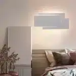 Modern wall sconce with three-layer stacked LED design in a living room