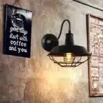 Vintage wall sconce with industrial iron cage and gooseneck arm