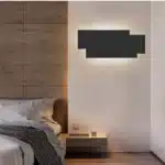 Modern wall sconce with three-layer stacked LED design in a living room