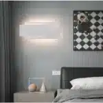 Modern wall sconce with three-layer stacked LED design in a living room