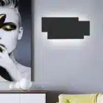 Modern wall sconce with three-layer stacked LED design in a living room