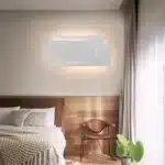 Modern wall sconce with three-layer stacked LED design in a living room